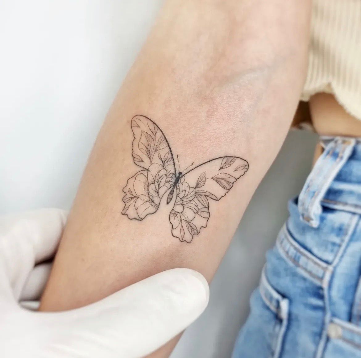 Fine line feminine tattoo by May