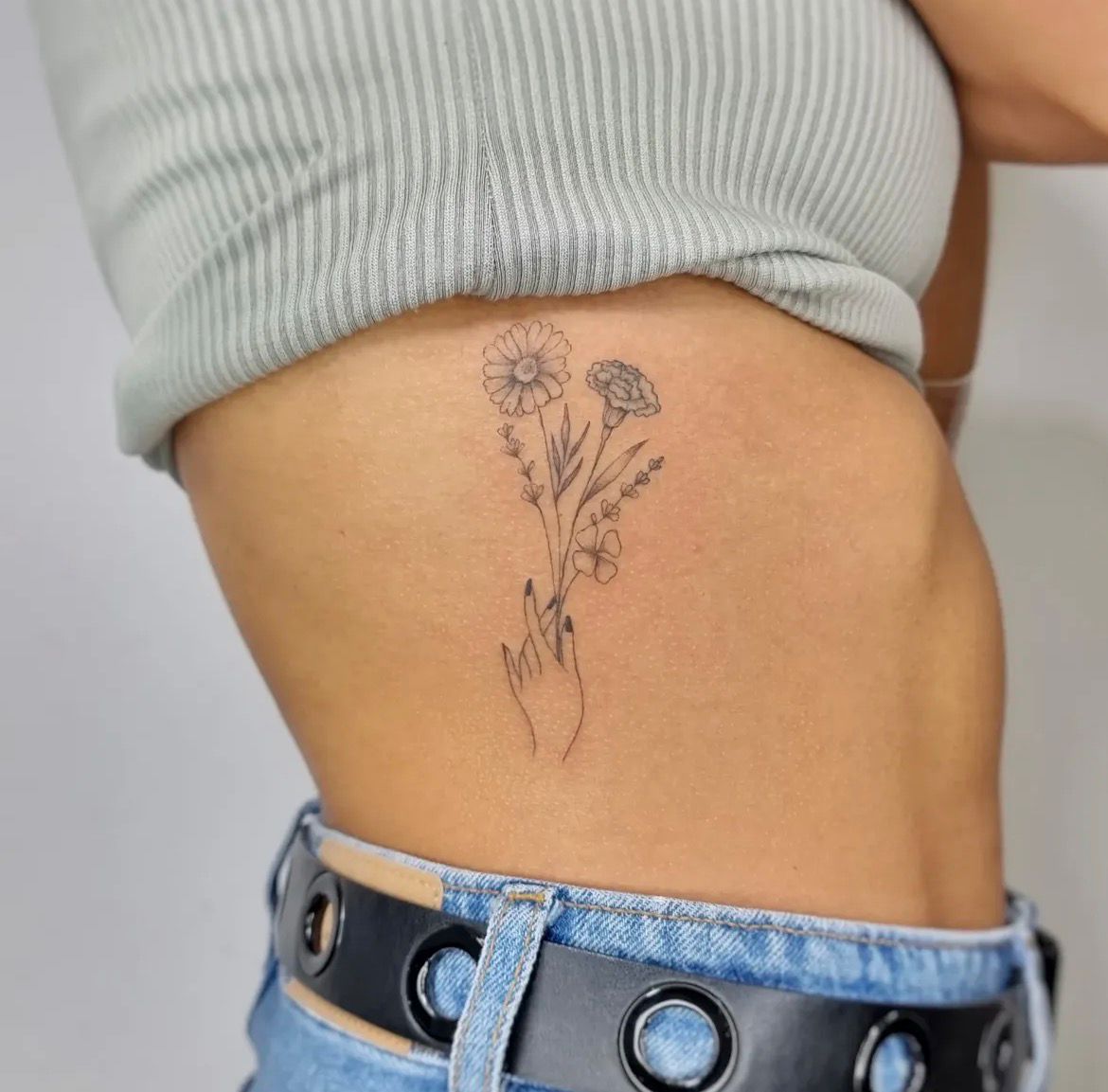 Fine line small tattoo by May
