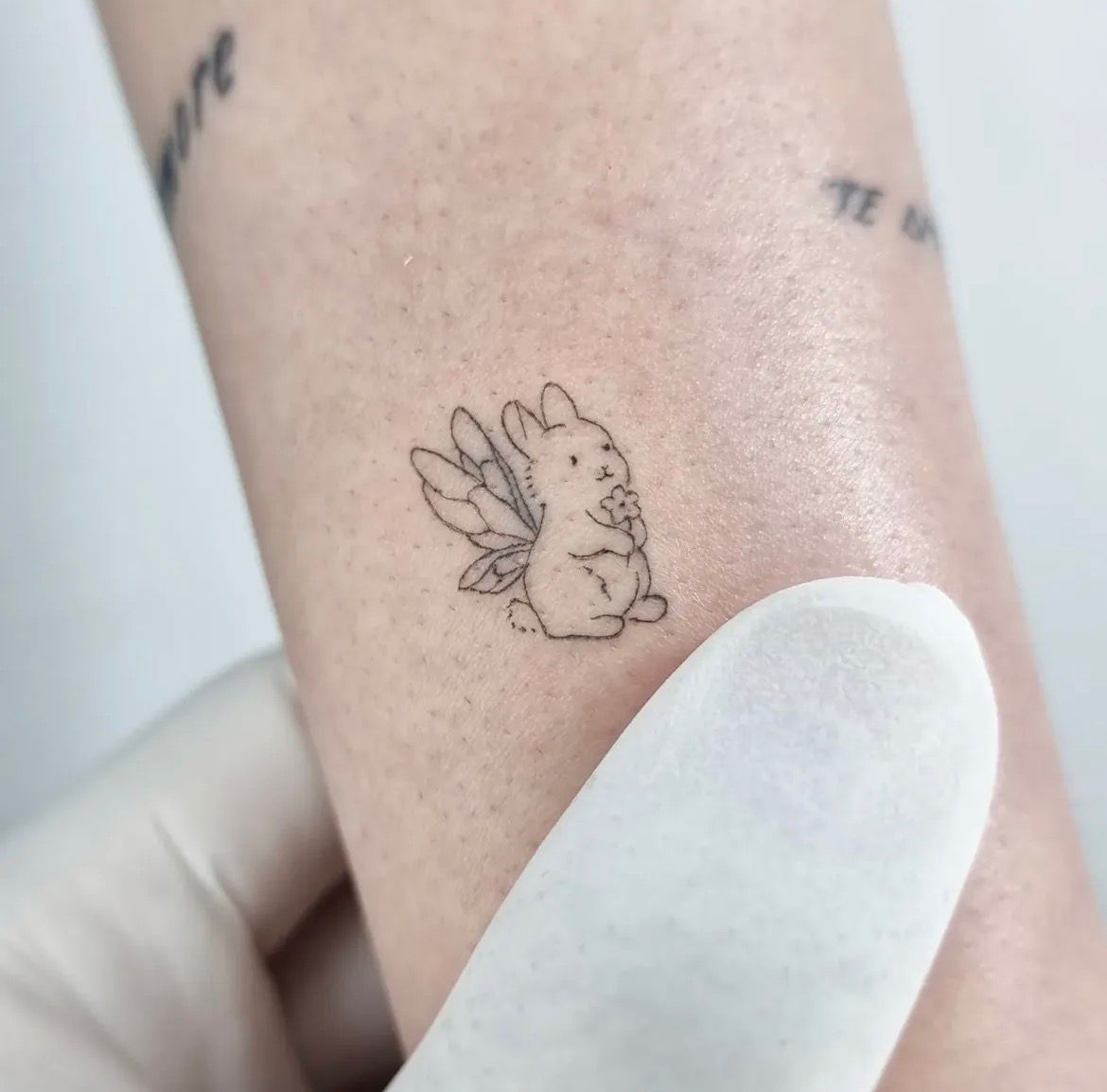 Fine line custom tattoo by May