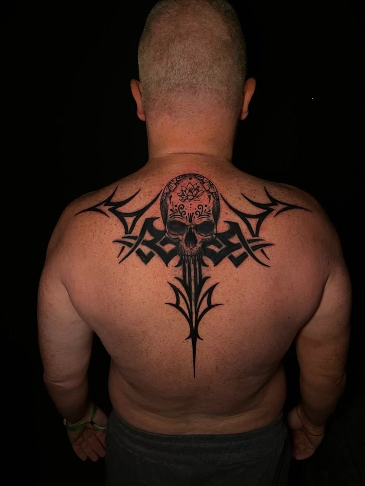 Tribal skull with lotus back piece